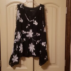 Black and white sleeveless blouse